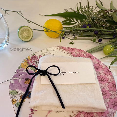 Maegmew party or baby shower table decor with classic black cards.