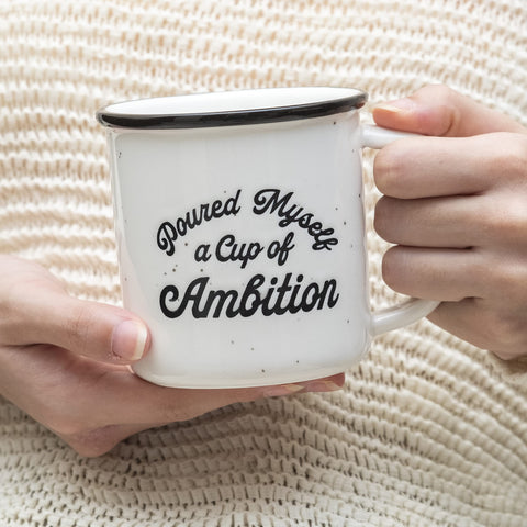 MAINEVENT Pour Myself a Cup of Ambition mug on a desk suggesting office coffee break