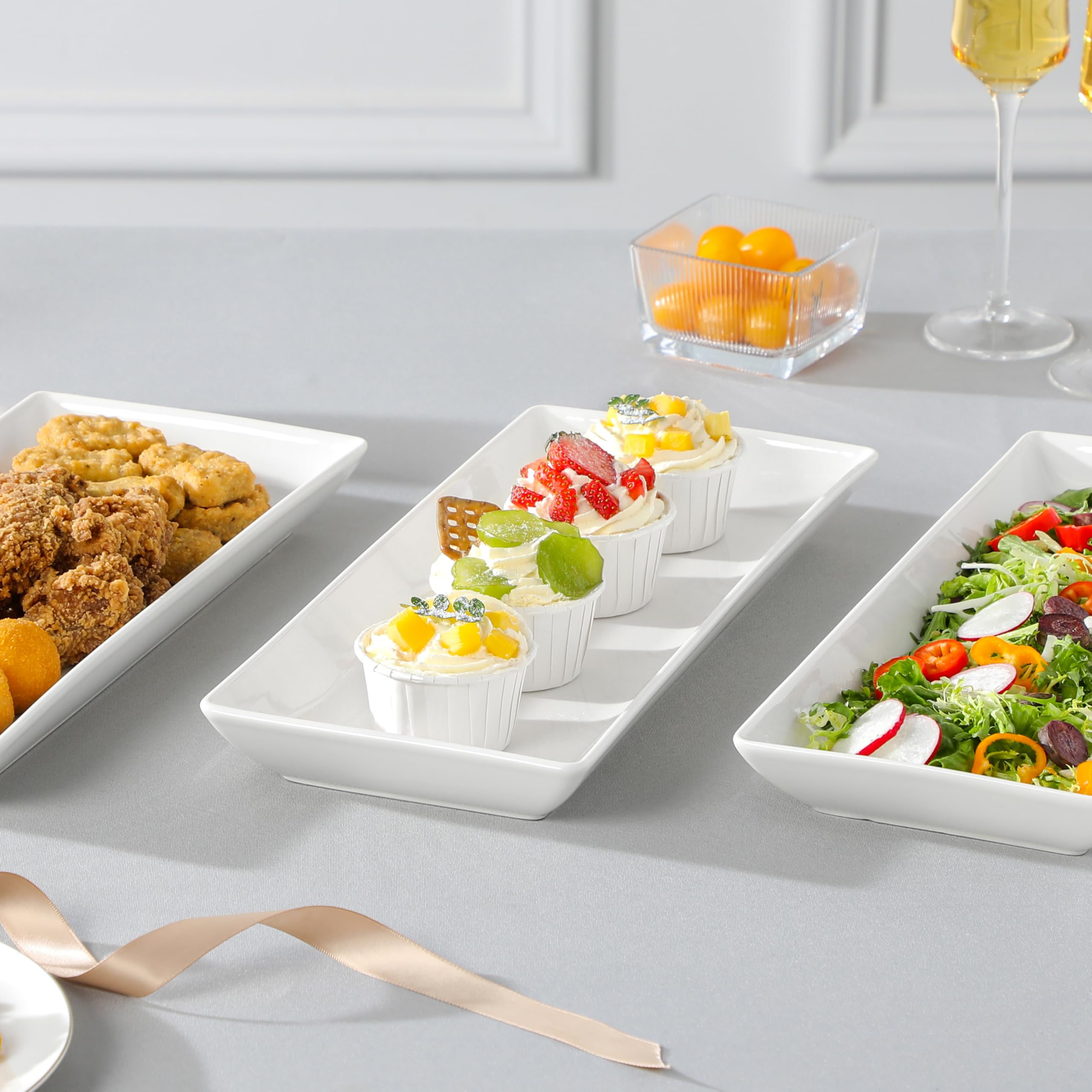 MALACASA wedding dessert table centerpiece with white trays.