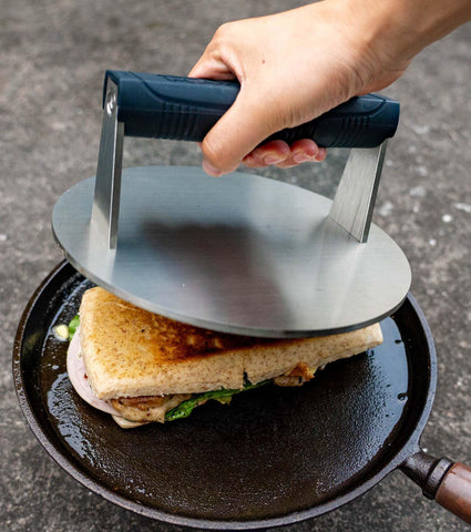 Manucode press on skillet delivers even contact for burgers and steaks