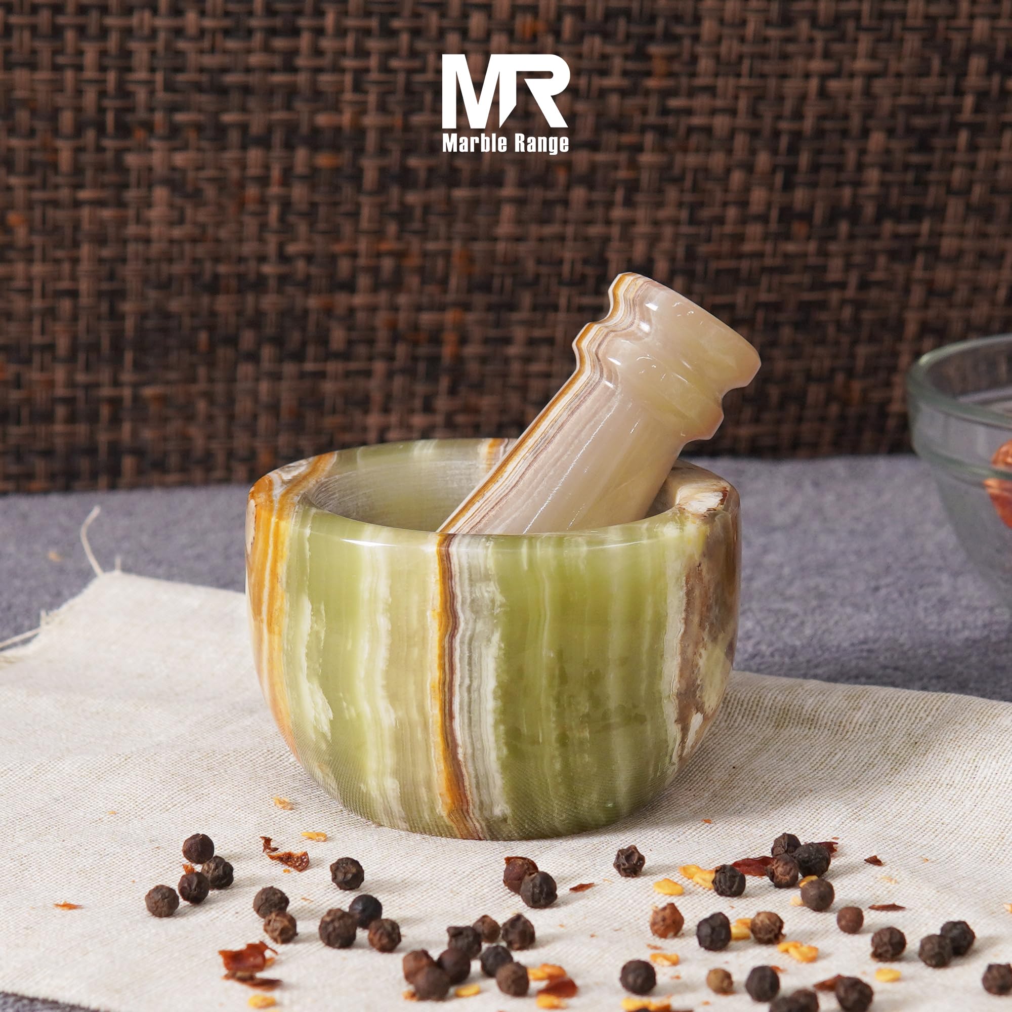 MARBLE RANGE garlic crusher and herb grinder in action for fresh flavors