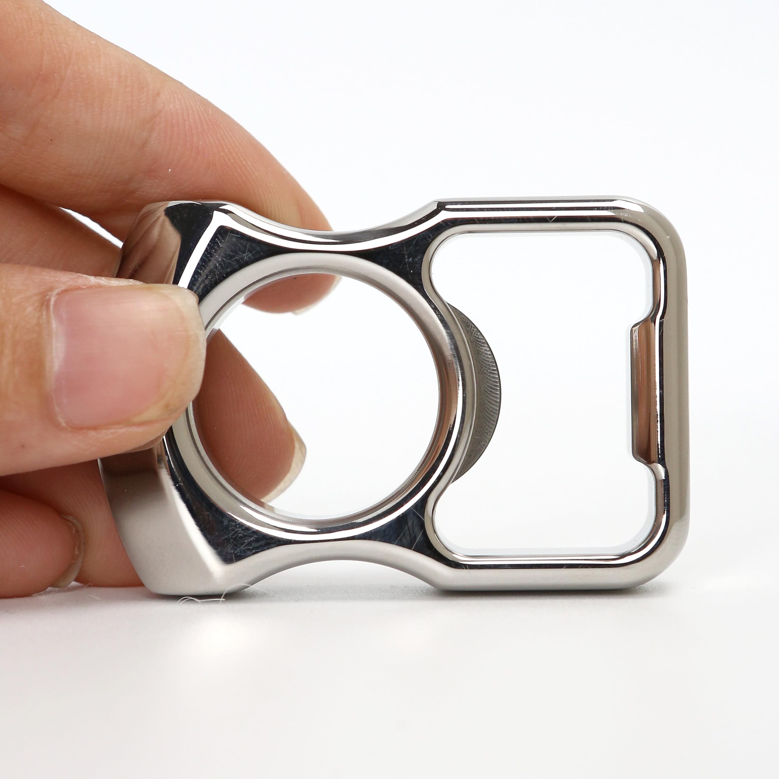 Marsrut compact-size bottle opener beside a bottle cap for scale.