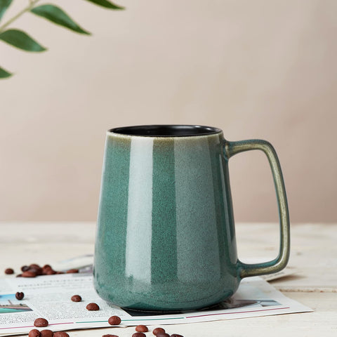Masoline green mug showing subtle reactive glaze color shifts.