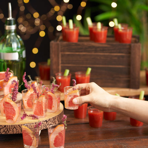 Matana clear plastic shot glasses ideal for wine tasting and sample stations.