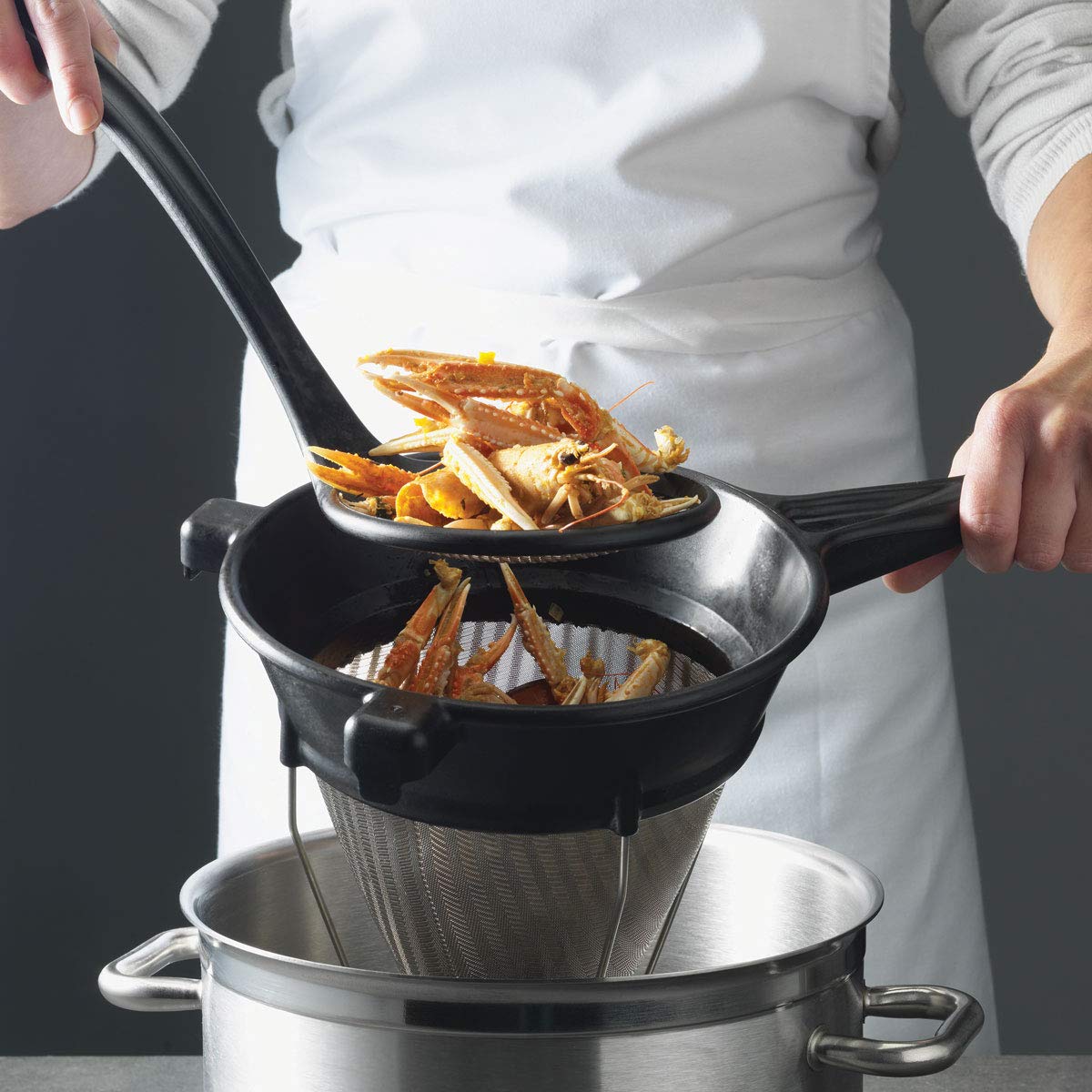Matfer Bourgeat bouillon strainer with Exoglass handle, 10 inch, sturdy and heat resistant for savory soups.