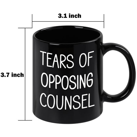 Maustic Tears of Opposing Counsel mug on desk, boosts mood during work.