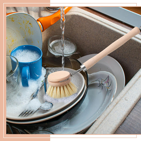 Maxdot wooden brush in action on sink and tiles for sparkling surfaces