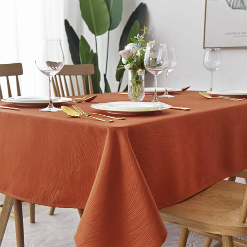 Maxmill tablecloth with heavy jacquard weave protects surfaces during meals.