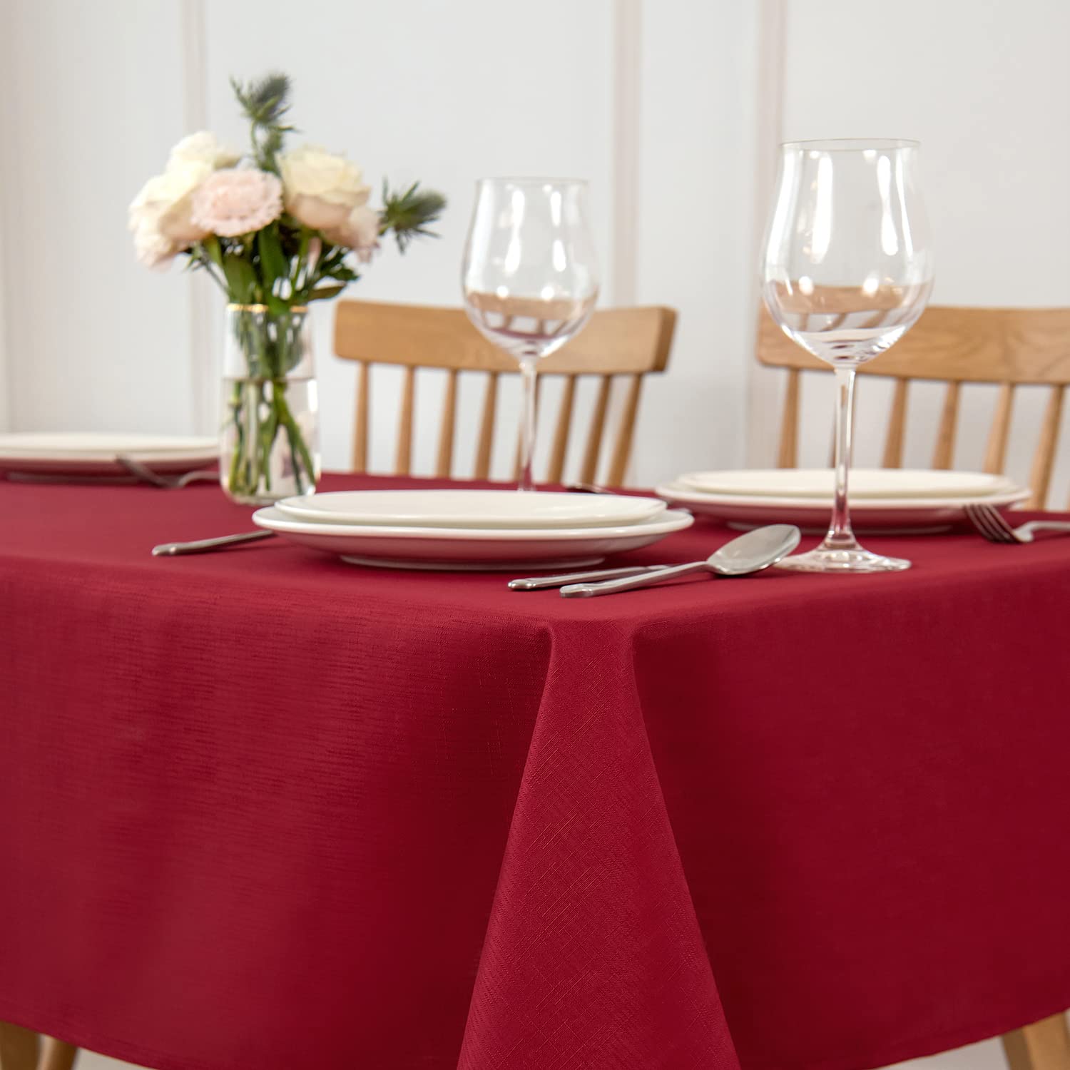 Maxmill red tablecloth on dining setup showing spill-proof surface for easy entertaining