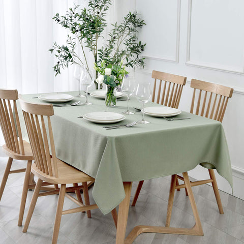 Maxmill textured rectangle tablecloth in sage green enhances dining aesthetics for elegant gatherings.