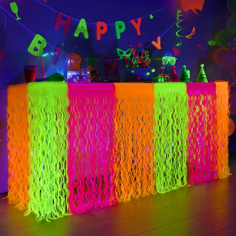 Mega-L Glow in the Dark table skirt in rose red enhances neon party vibes.