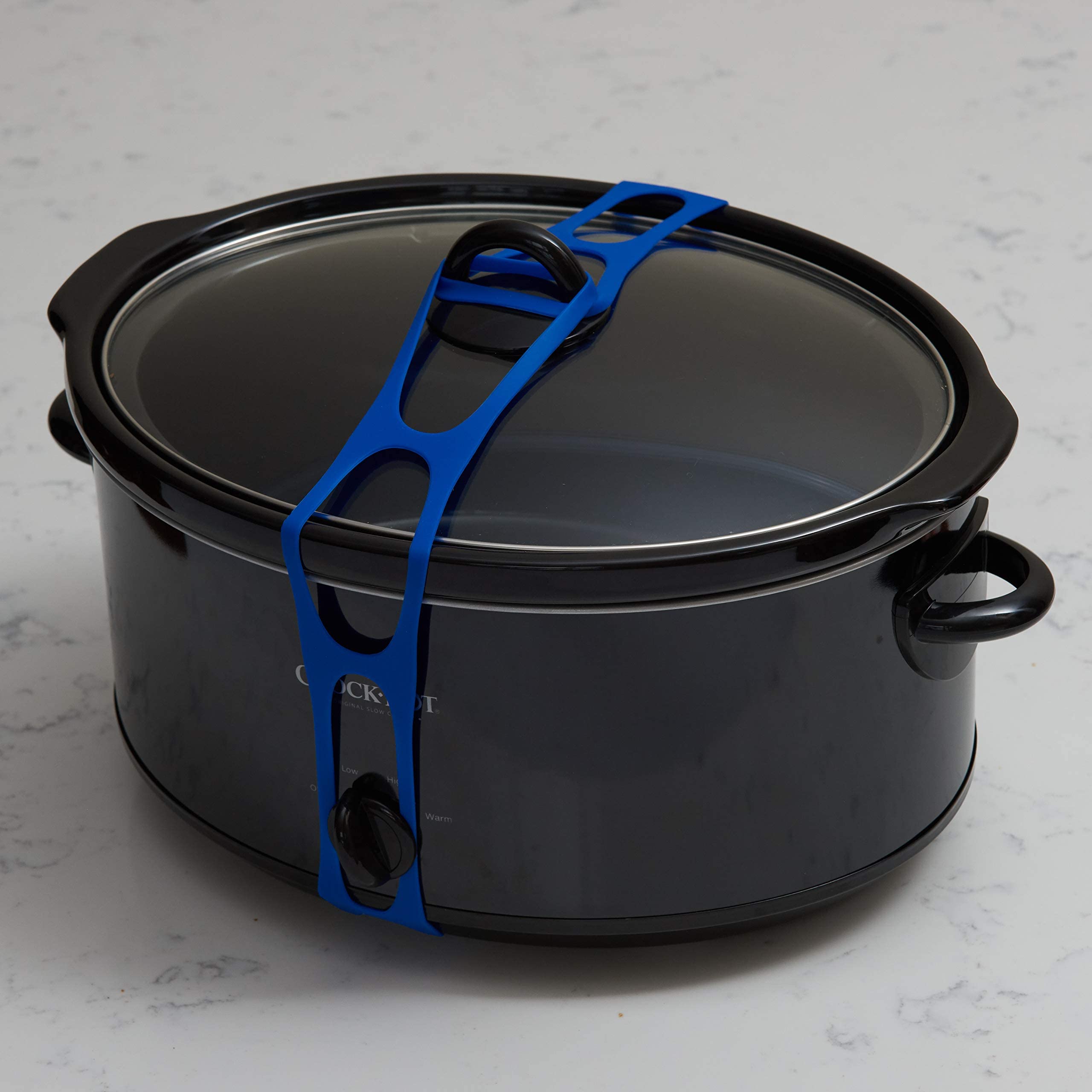 Mella Lid Latch secured around a six-to-eight-quart slow cooker for universal fit.
