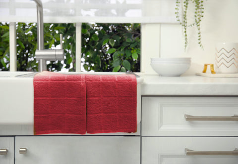 Mellow Buff reusable cleaning cloths in red complementing modern kitchen decor.