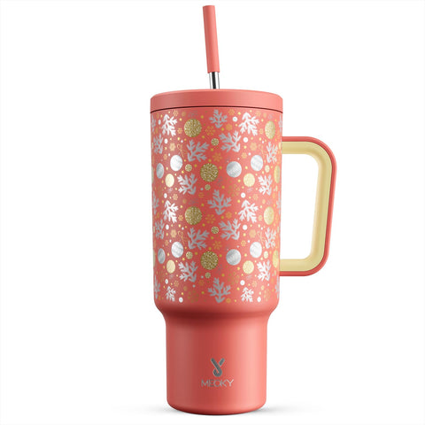 Meoky Merry Bells tumbler with handle and straw keeps cocoa warm during cozy evenings.