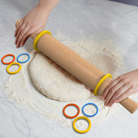 Mepple wooden rolling pin in action rolling out dough evenly.