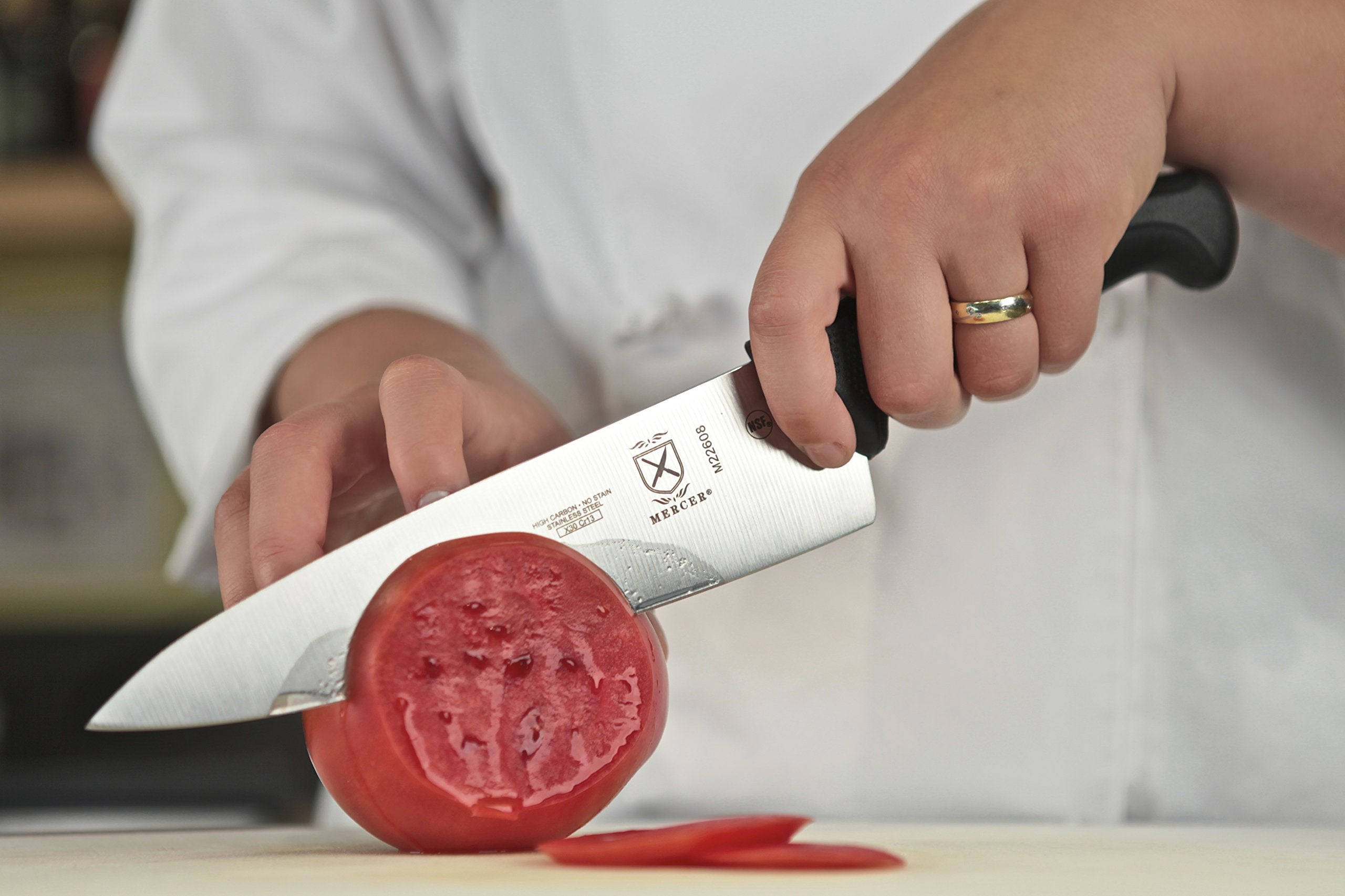 Mercer Culinary Millennia 8-Inch knife handle with ergonomic grip for comfortable prep.