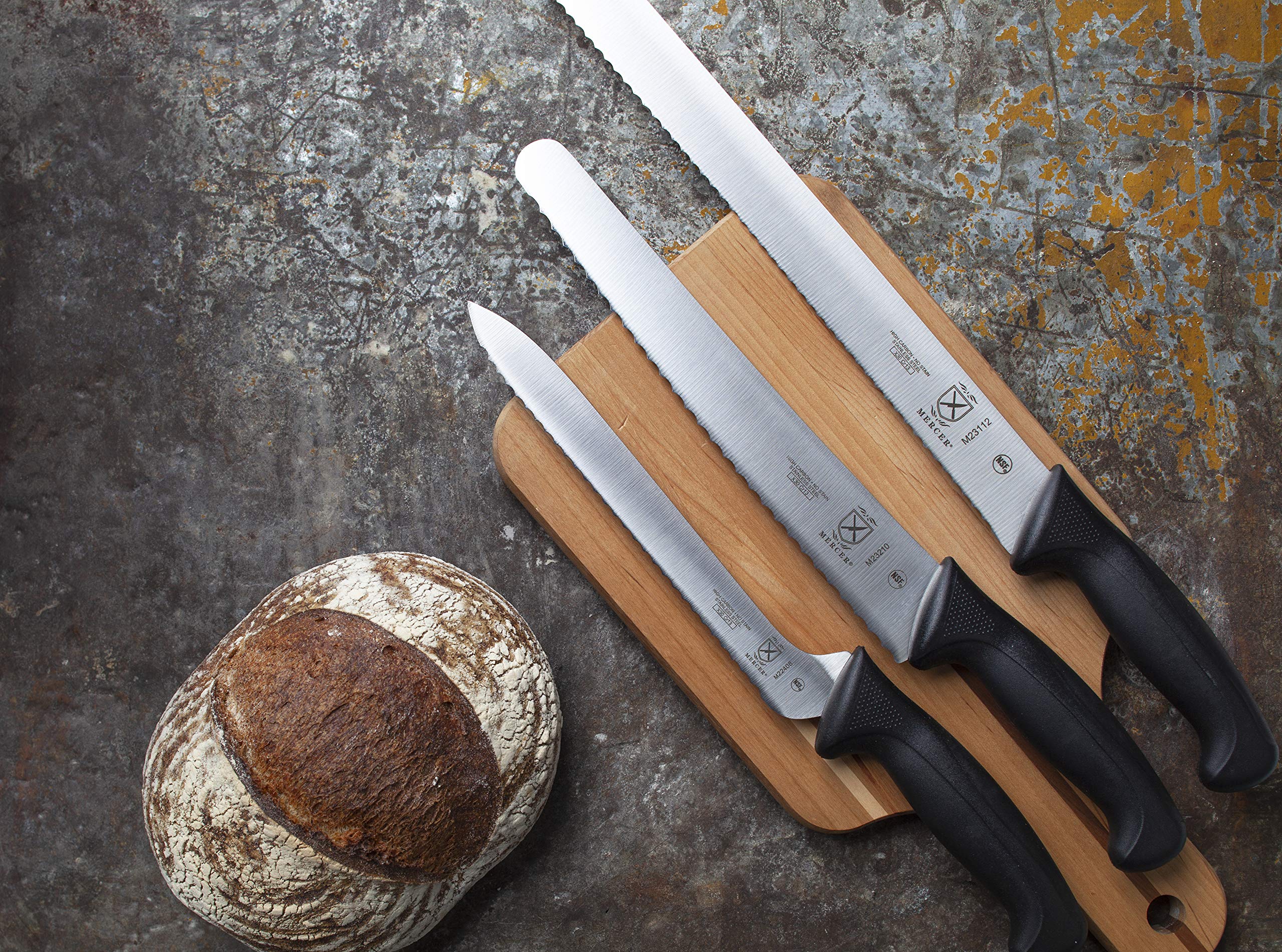 Mercer Millennia in-use shot highlights precise kitchen cutting control.