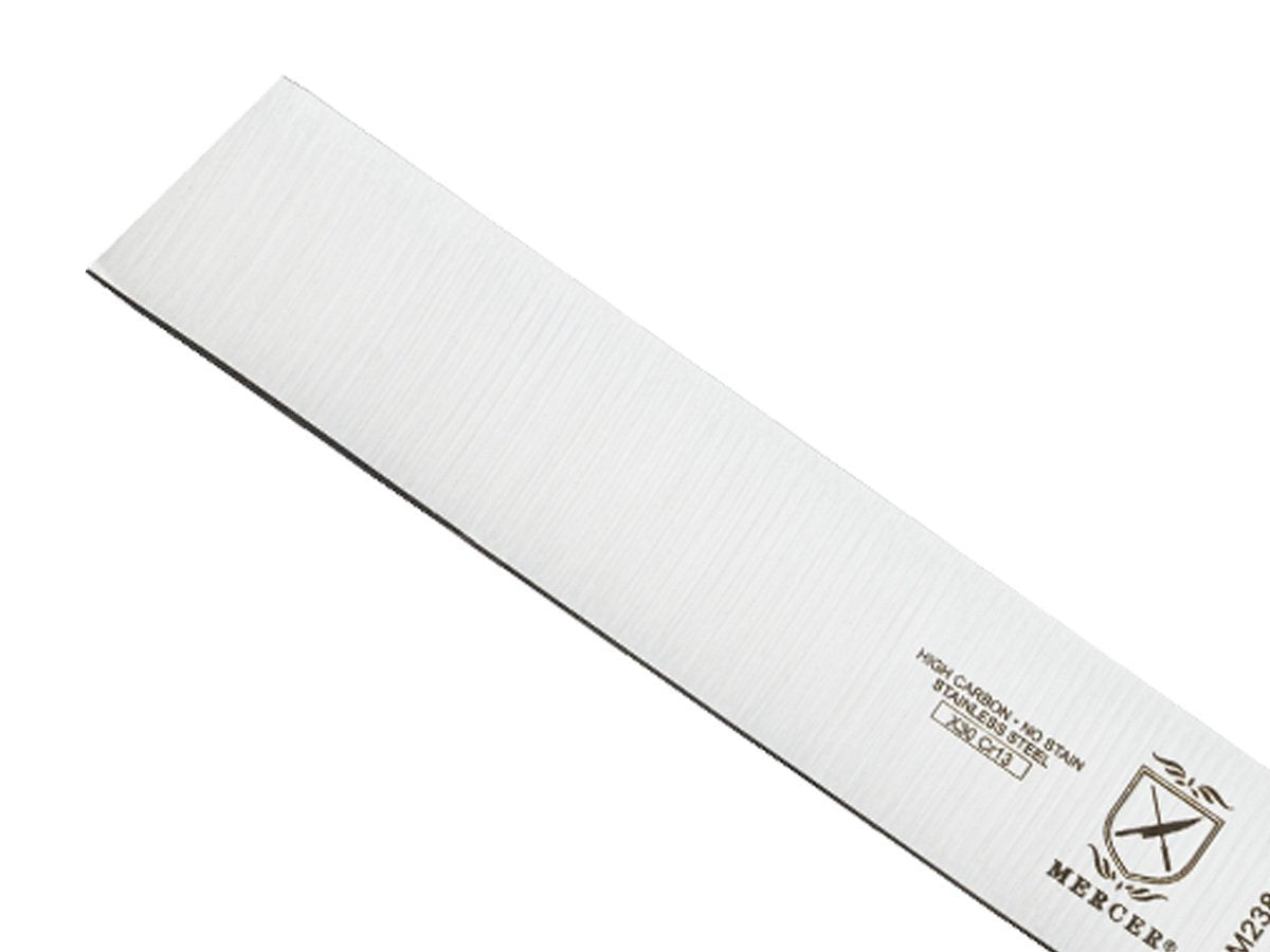 Side view shows ergonomic green handle for comfortable, non-slip grip during long prep sessions.