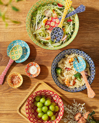 Metahom ceramic salad servers pictured on a dining table ready to serve
