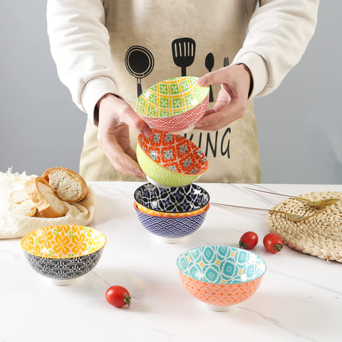 Bright geometric patterns on Metahom bowls enhance dessert presentation and table styling.