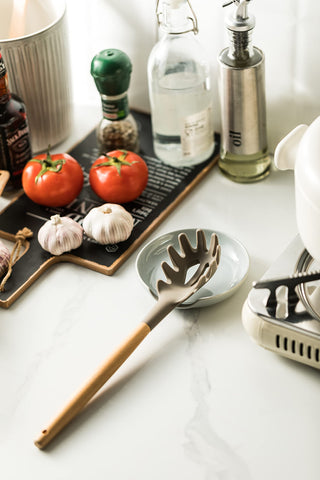 Miamolo light gray spoon rest adds subtle style and practicality.