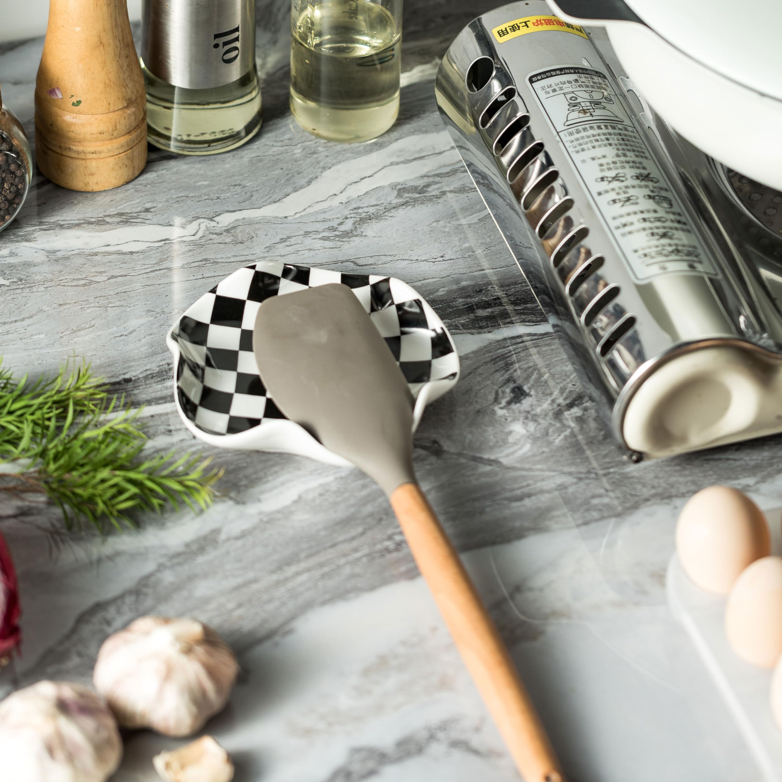 Miamolo ceramic spoon rest doubles as a small catch-all for rings or teabags.