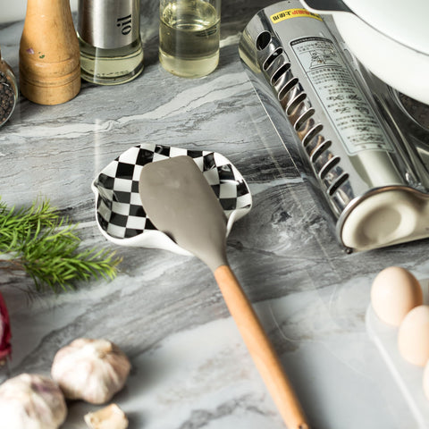 Miamolo ceramic spoon rest doubles as a small catch-all for rings or teabags.