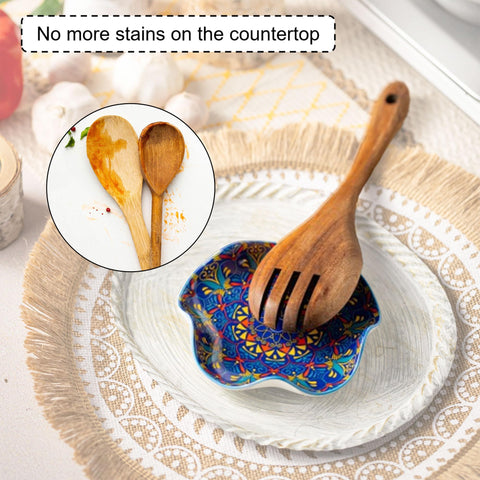 Miamolo ceramic spoon rest features flower edge for spill containment.