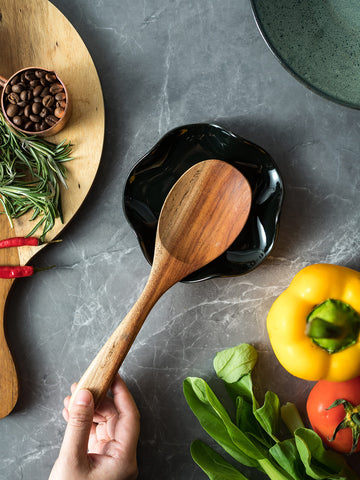 Miamolo spoon rest used as utensil storage keeps spatulas organized.