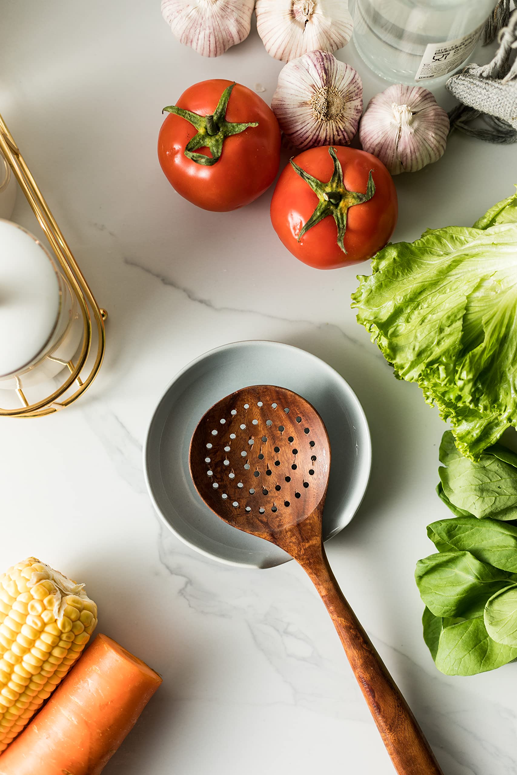 Miamolo spoon rest with drip tray catches spills for tidy countertops.