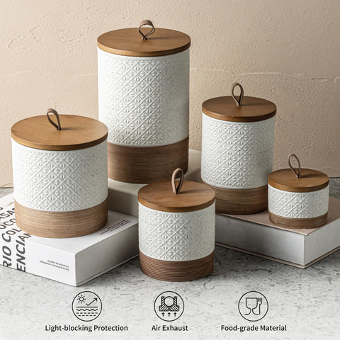 Miamolo white ceramic jar anchors countertop organization and style.