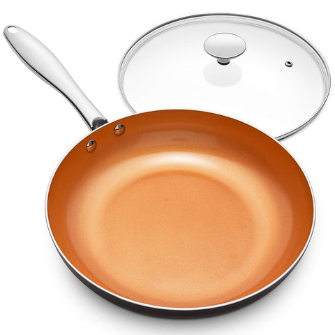 Michelangelo 10-inch copper nonstick pan with lid for versatile cooking and easy release.