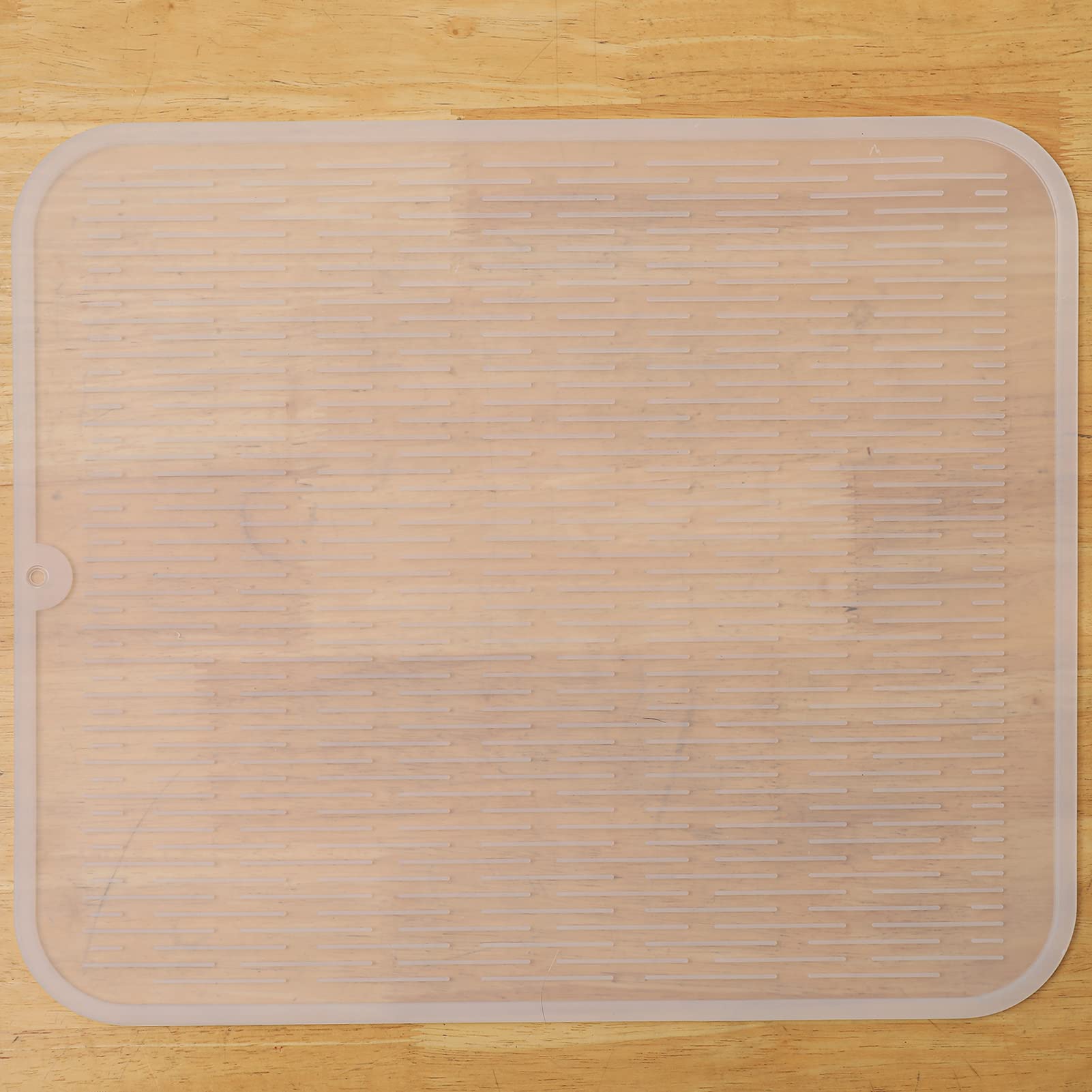 MicoYang silicone dish drying mat on a kitchen counter, providing a drying surface and surface protection.