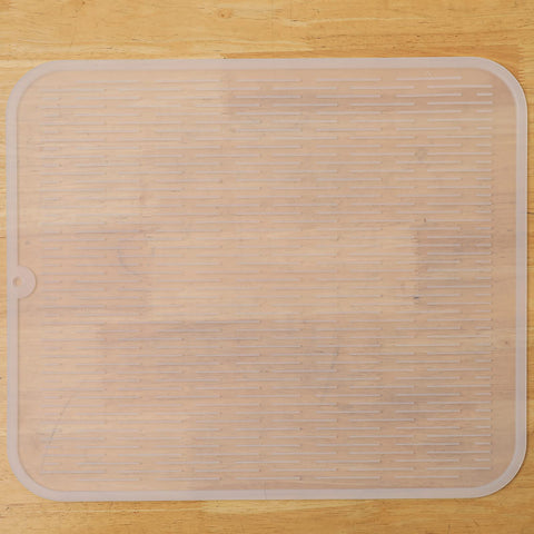 MicoYang silicone dish drying mat on a kitchen counter, providing a drying surface and surface protection.