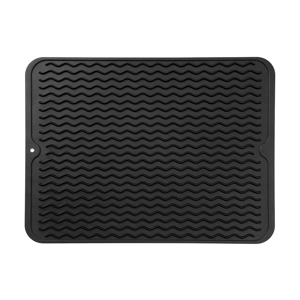 MicoYang silicone drying mat on a kitchen counter, protecting surfaces while air-drying dishes.