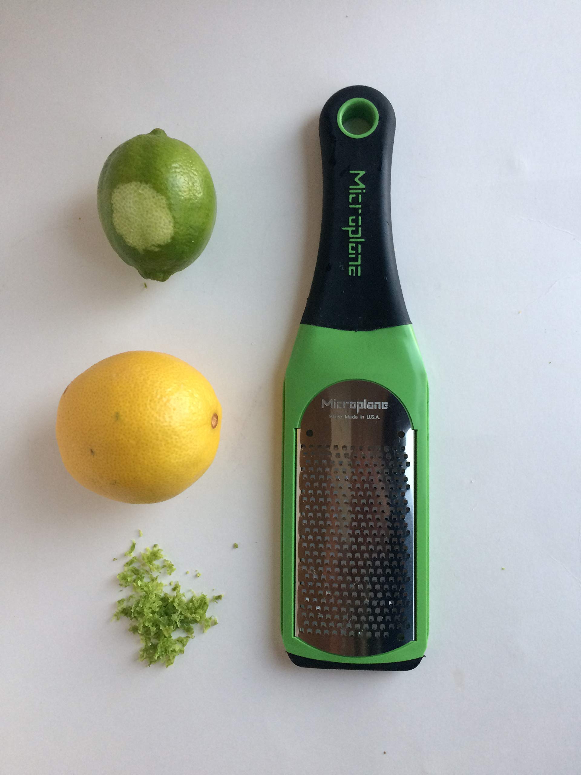 Parmesan snow finishing on pasta with Microplane Artisan Grater