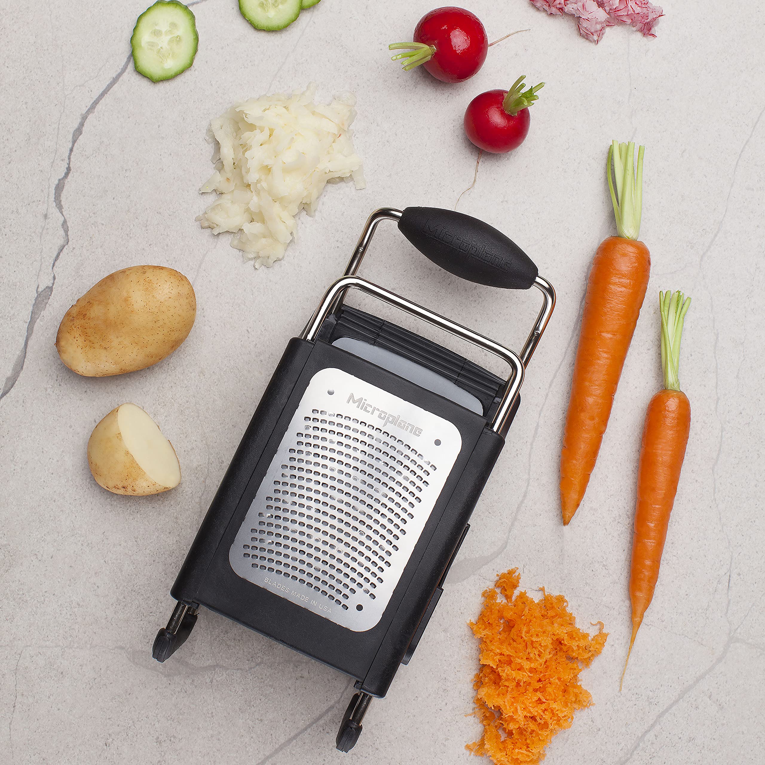 Microplane four-sided box grater ergonomic handle, comfortable grip during prep.