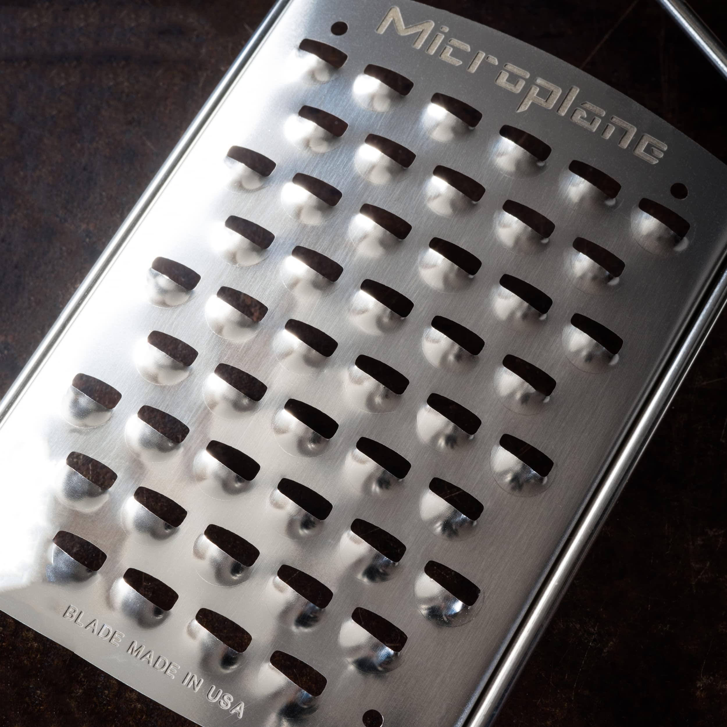 Microplane Gourmet Ultra Coarse Grater blade closeup highlighting large teeth for quick shredding.