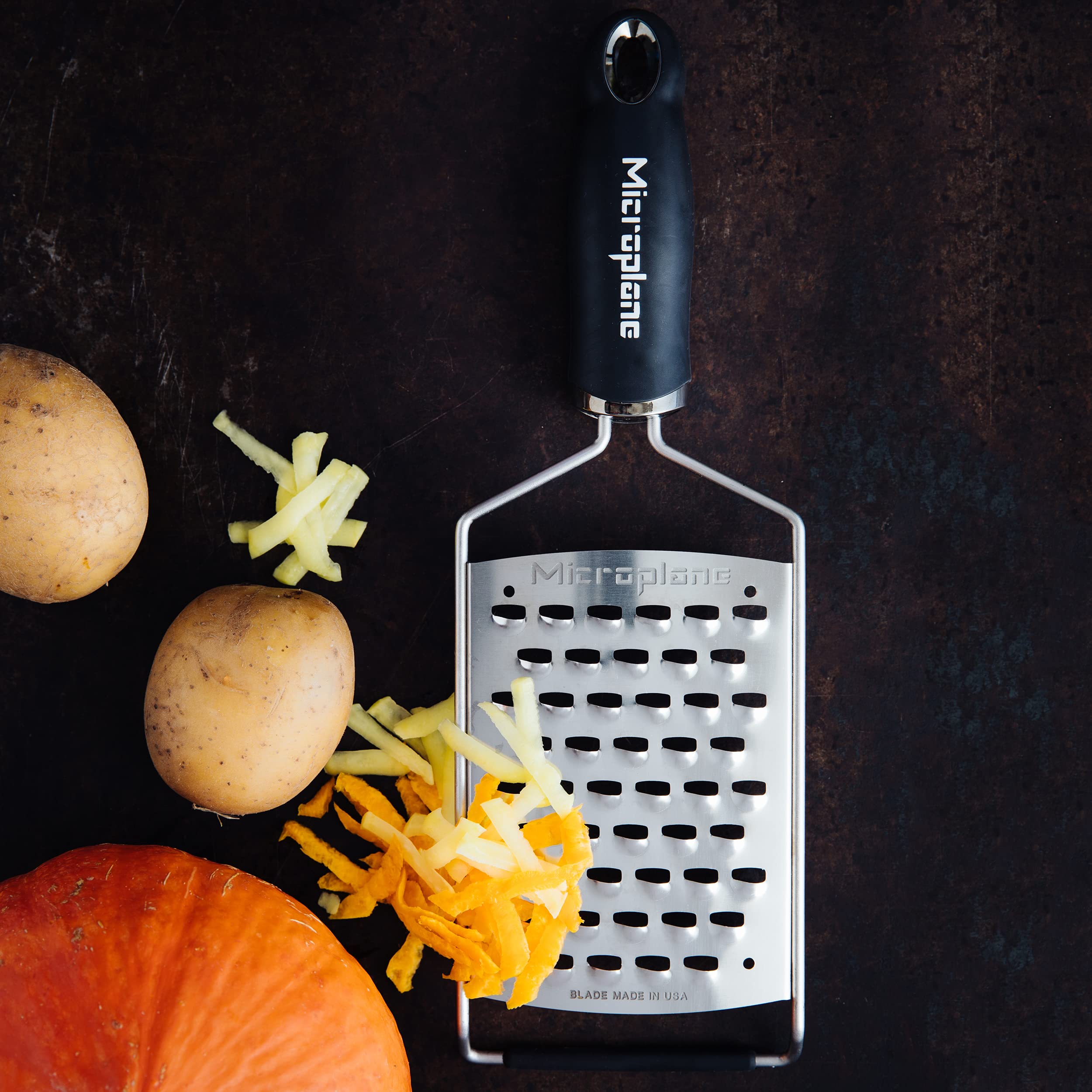 Microplane Gourmet Ultra Coarse Grater shows top-rack dishwasher safety for convenient cleaning.