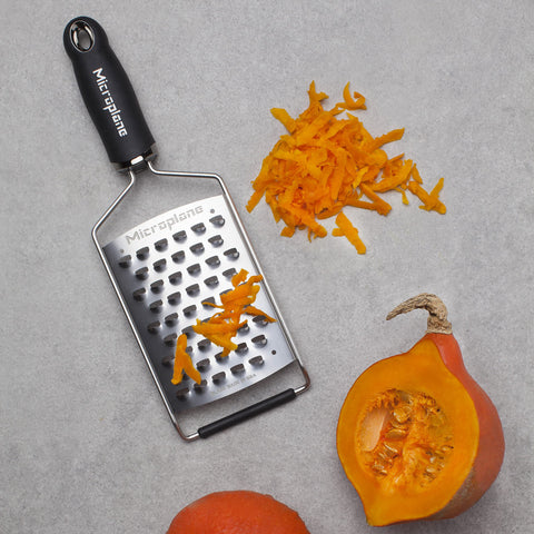 Microplane Gourmet Ultra Coarse Grater shreds soft and hard cheeses efficiently.