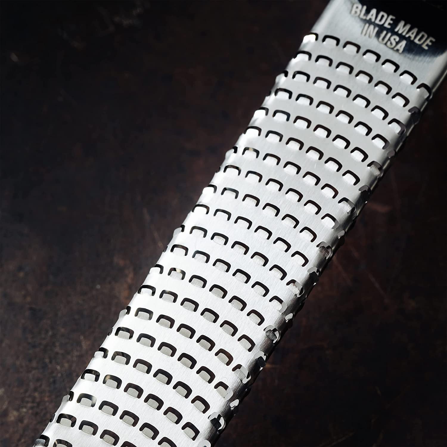 Microplane Premium Classic Zester Orange grating ginger and garlic into fresh pastes.