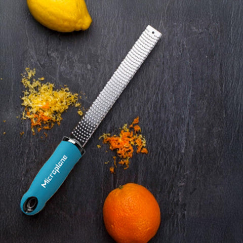 Microplane Premium Classic Turquoise zester blade closeup shows ultra sharp, rust-free performance.