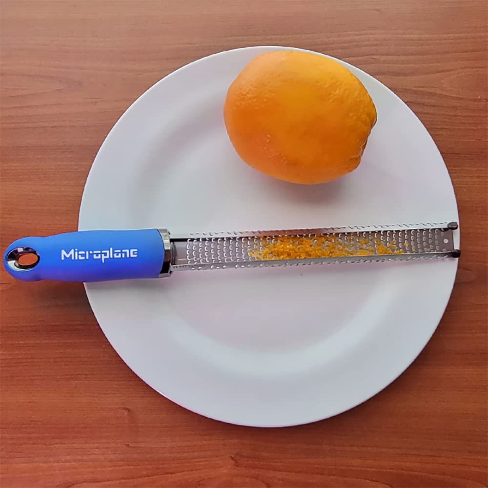Microplane zester removing burnt spots from cookies for neat presentation