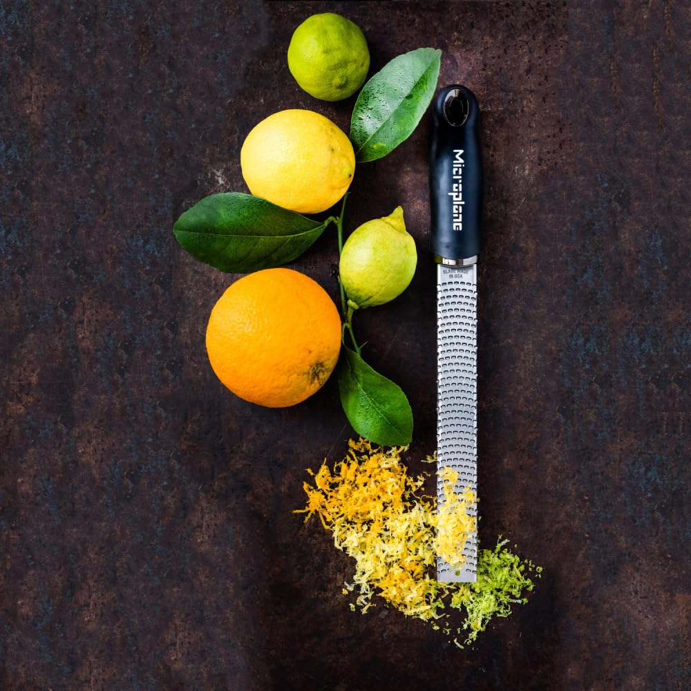 Microplane Premium Classic Zester adding citrus zest to vinaigrette