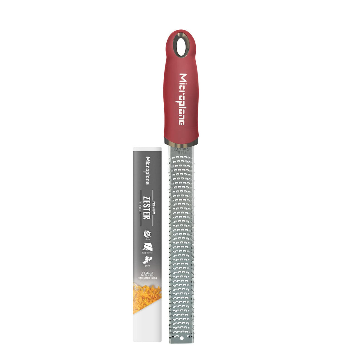 Microplane Premium Classic Zester close-up: pomegranate red handle for citrus zest.