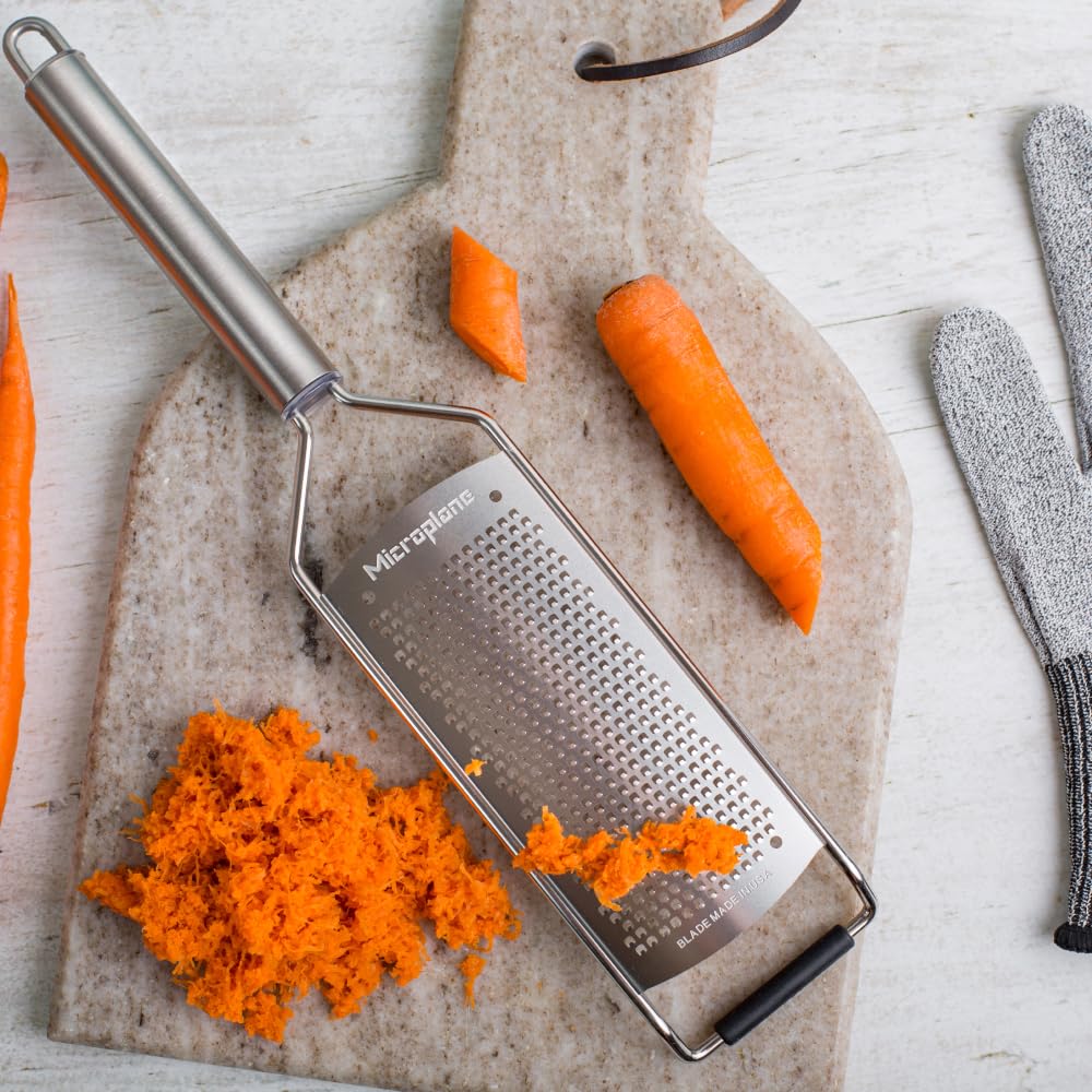 Microplane handle grip close-up shows secure, comfortable use during prep.