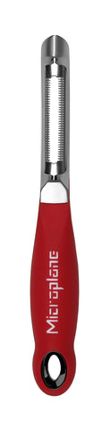 Microplane mango peeler showing smooth peeling of soft fruit