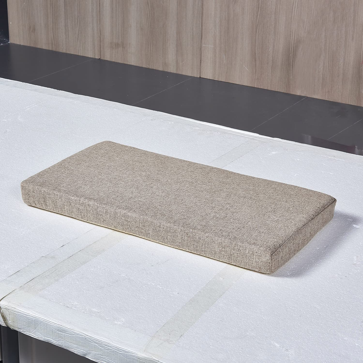 MICUSHION cushion with back ties to prevent shifting on a bench.