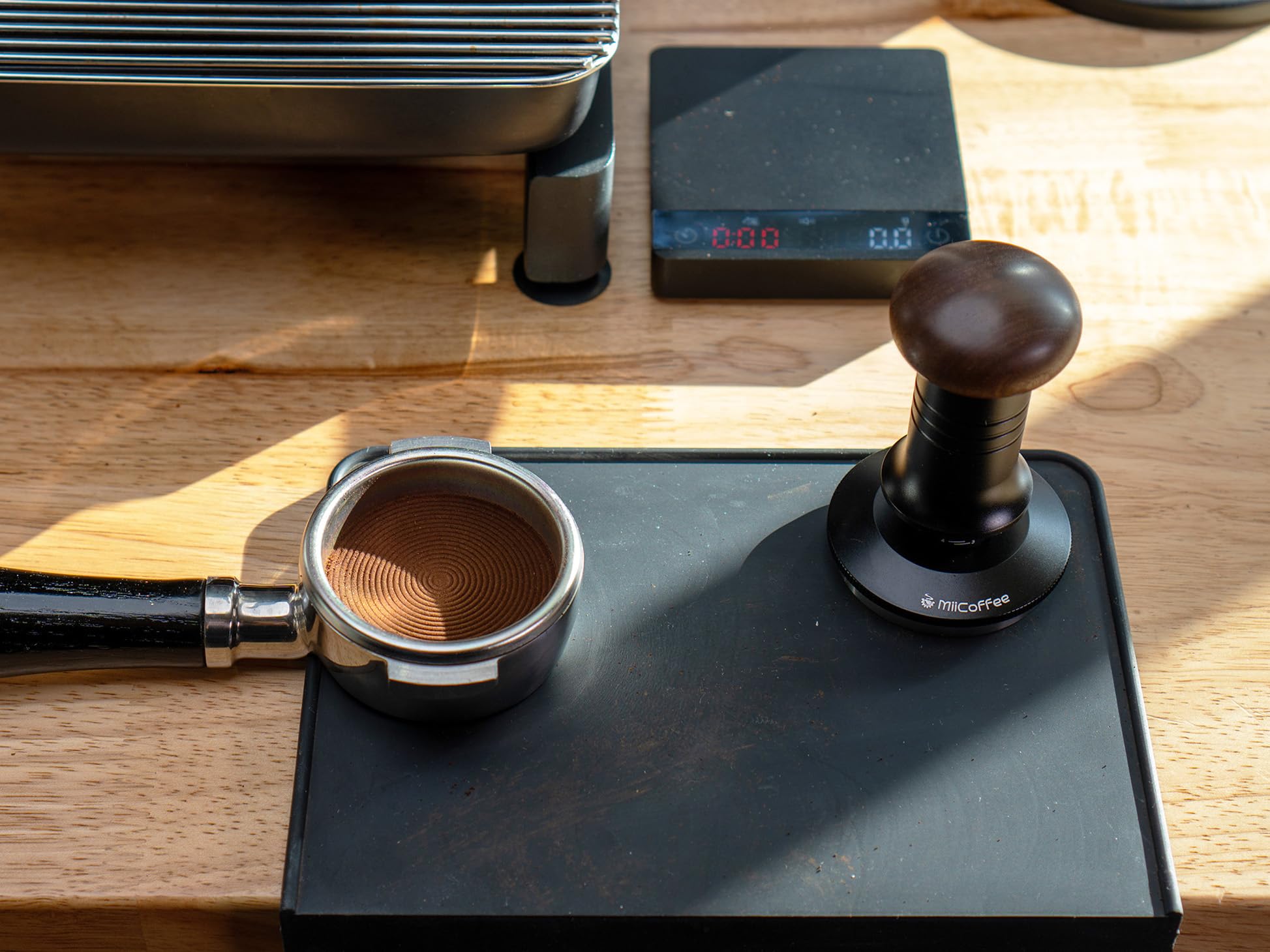 MiiCoffee 58.5mm base fits most 58mm portafilters and reduces edge powder.