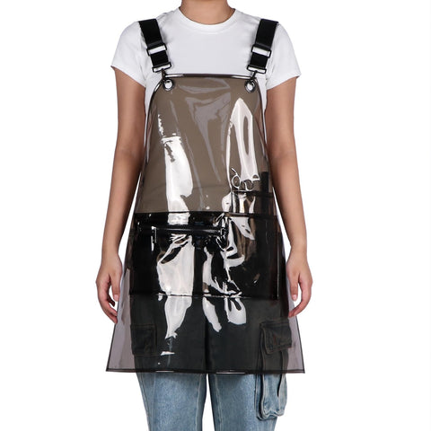 MIKI WELL transparent apron highlighting tool storage while protecting clothing.